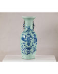 Cobalt blue and white porcelain vase with scholar images and ornate handles, displayed on a white surface.