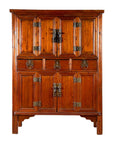 Brown wood antique cabinet with original metal hardware, upper and lower doors, and three central drawers.