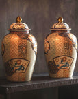 Pair of Arita Style Lidded Jars with Gold, Blue and Orange Floral Motifs