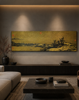 Gilt metal landscape wall panel with red seal marks above a low console in a modern living room with neutral tones.