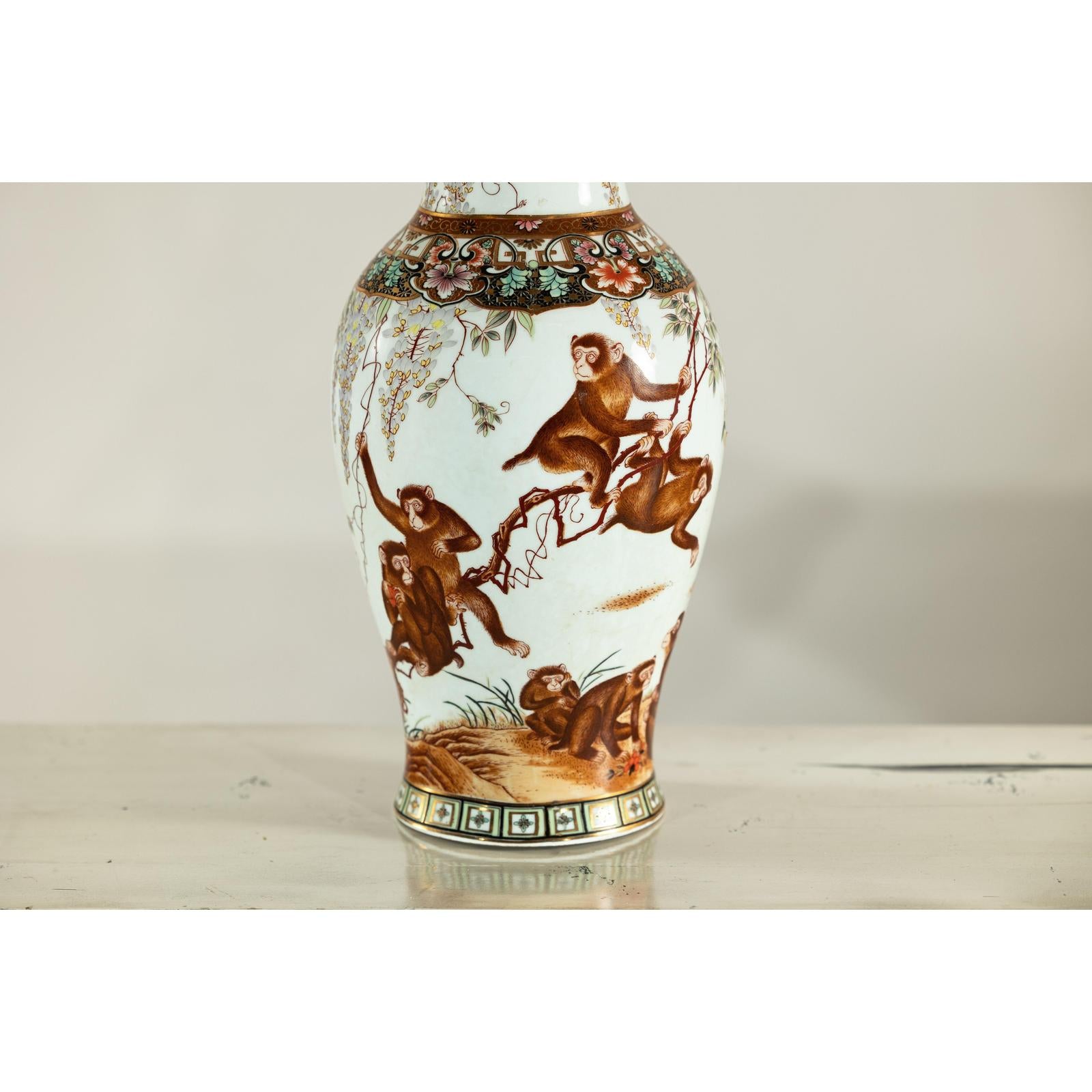 Porcelain Baluster Shaped Vase with Hand-Painted Monkeys and Floral Motifs