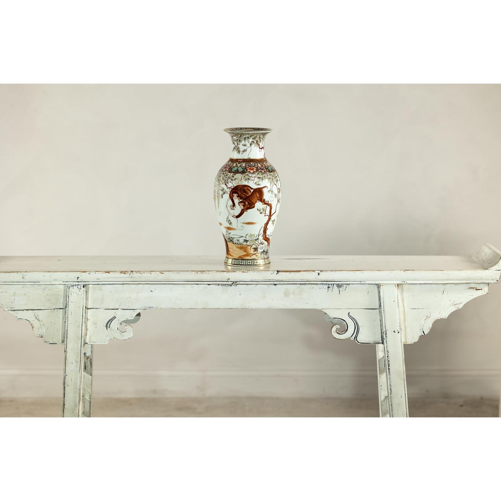 Porcelain Baluster Shaped Vase with Hand-Painted Monkeys and Floral Motifs