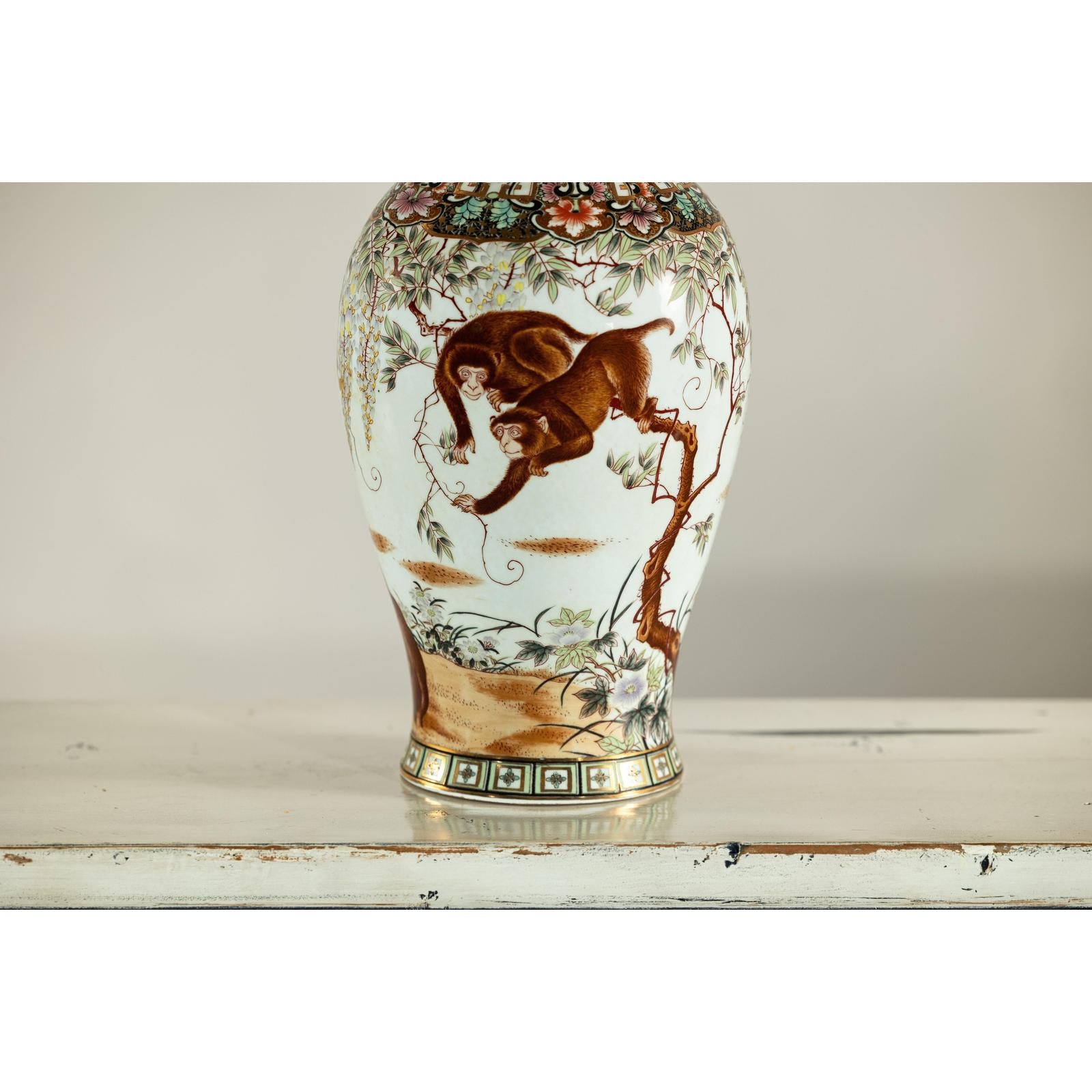 Porcelain Baluster Shaped Vase with Hand-Painted Monkeys and Floral Motifs