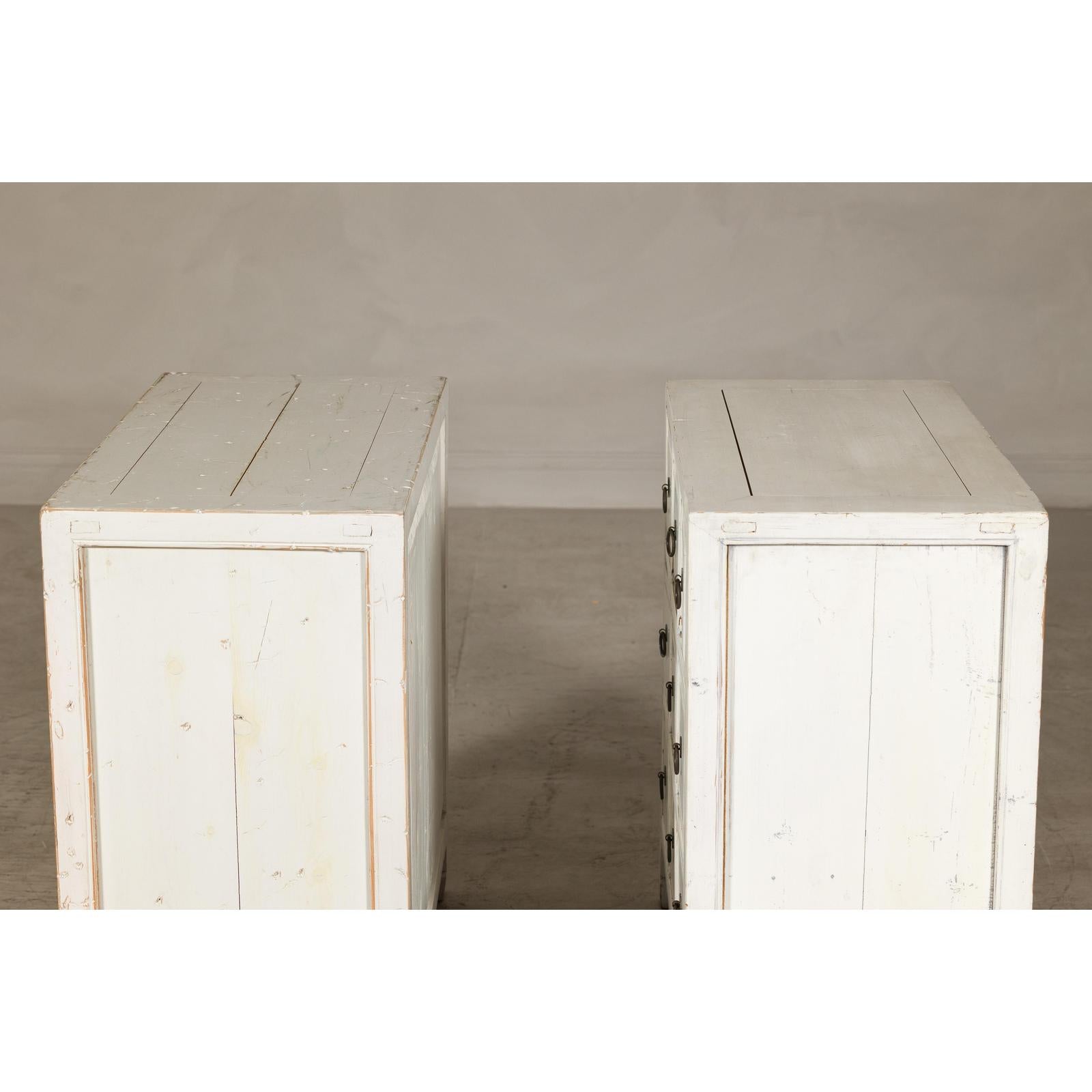 Vintage Distressed White Lacquer Apothecary Chests – Near Pair with Nine Drawers