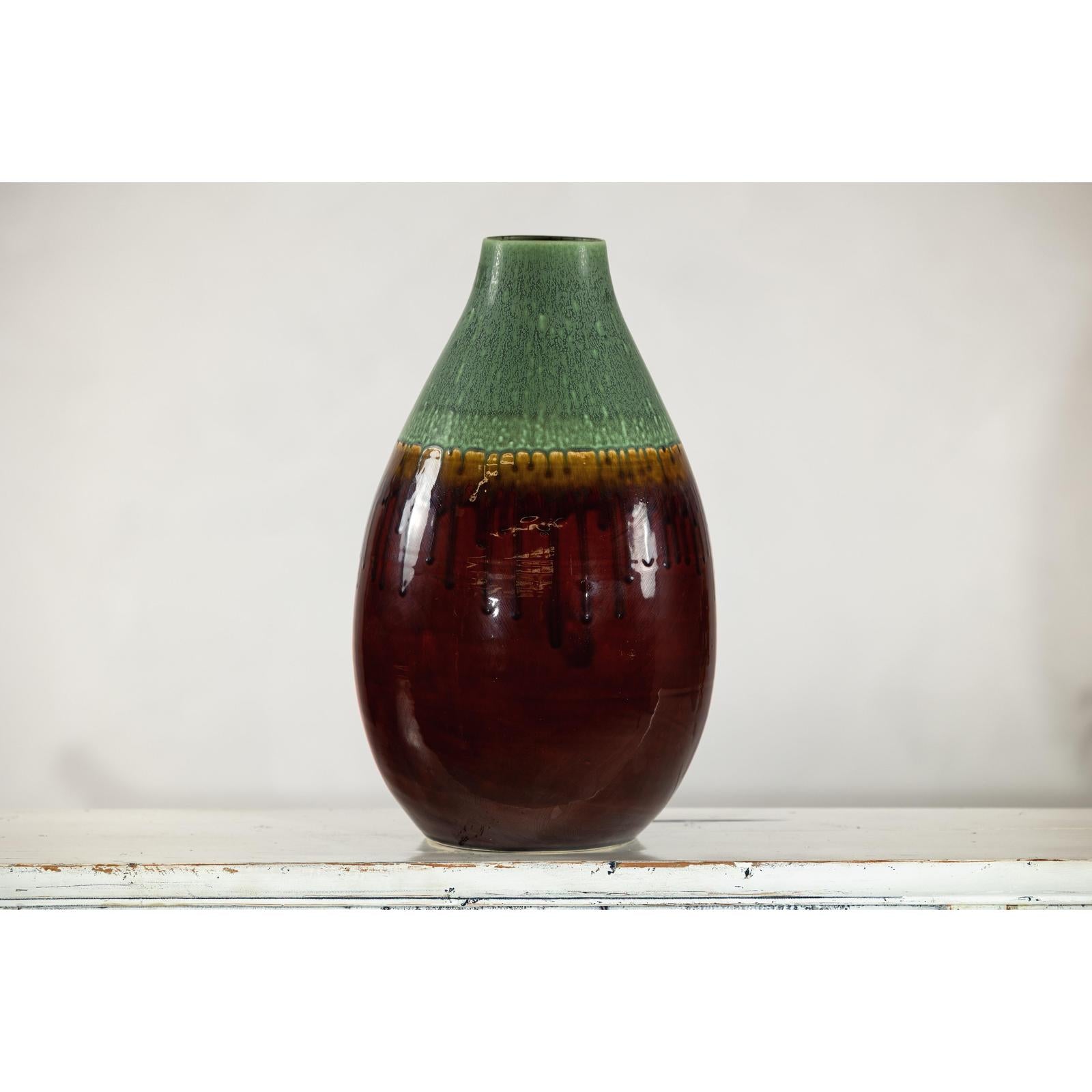 Green and Brown Glazed Ceramic Vase with Drip Effect and Rounded Silhouette