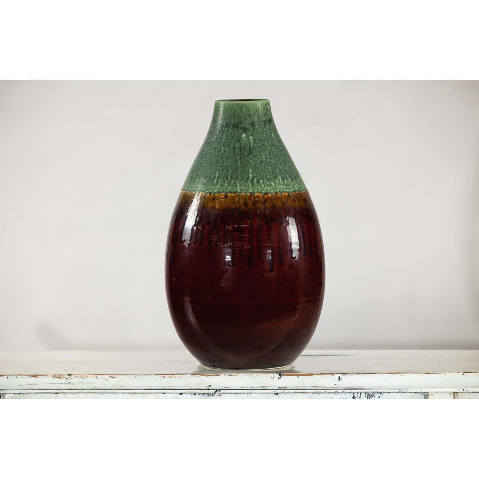 Green and Brown Glazed Ceramic Vase with Drip Effect and Rounded Silhouette