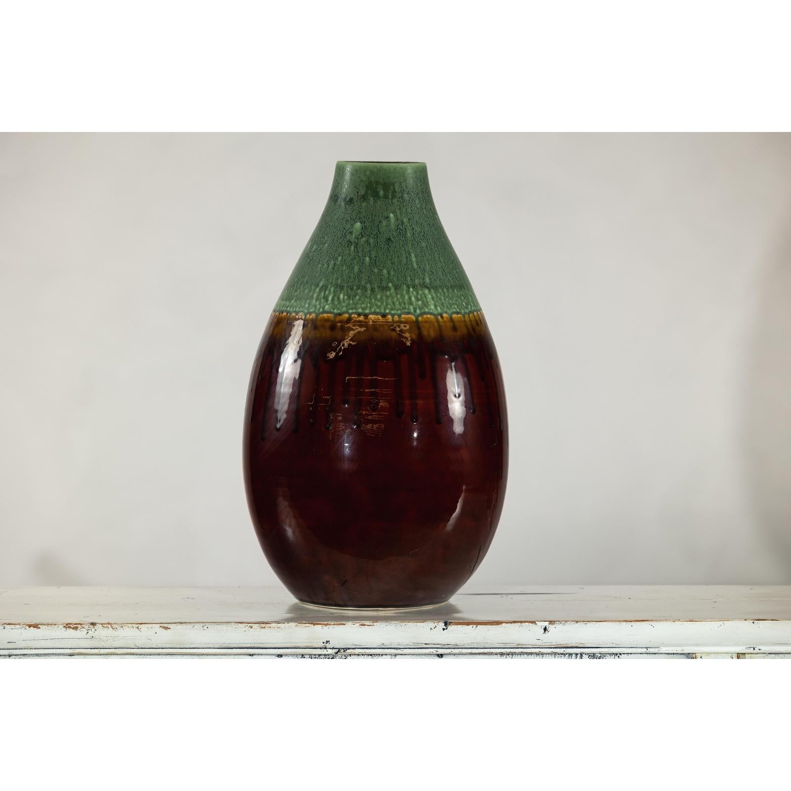 Green and Brown Glazed Ceramic Vase with Drip Effect and Rounded Silhouette
