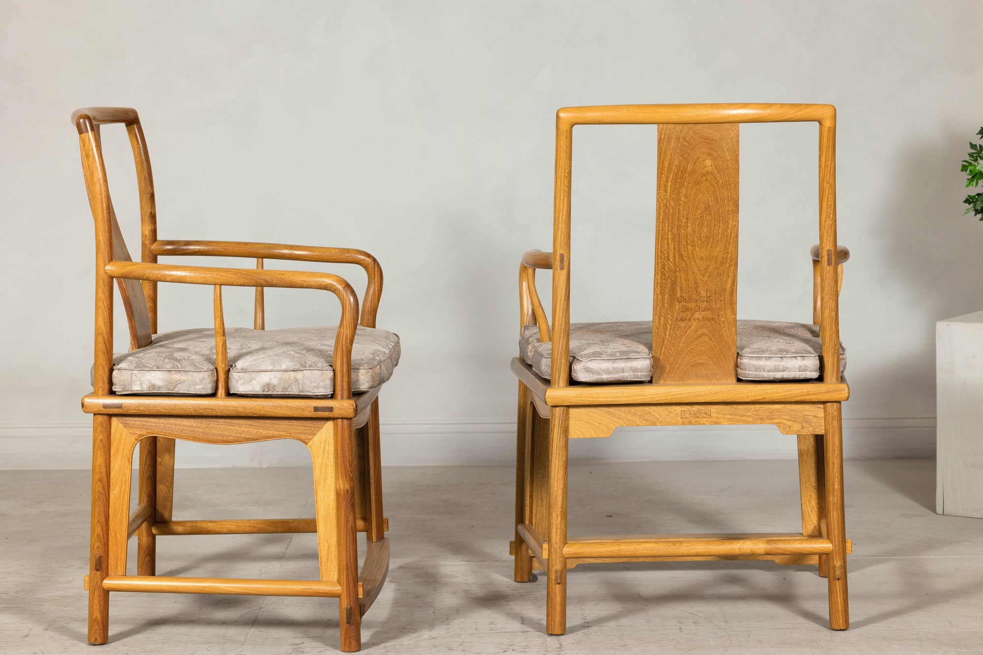 Pair of Ming-Style Hardwood Armchairs with Carved Medallion and Cushions