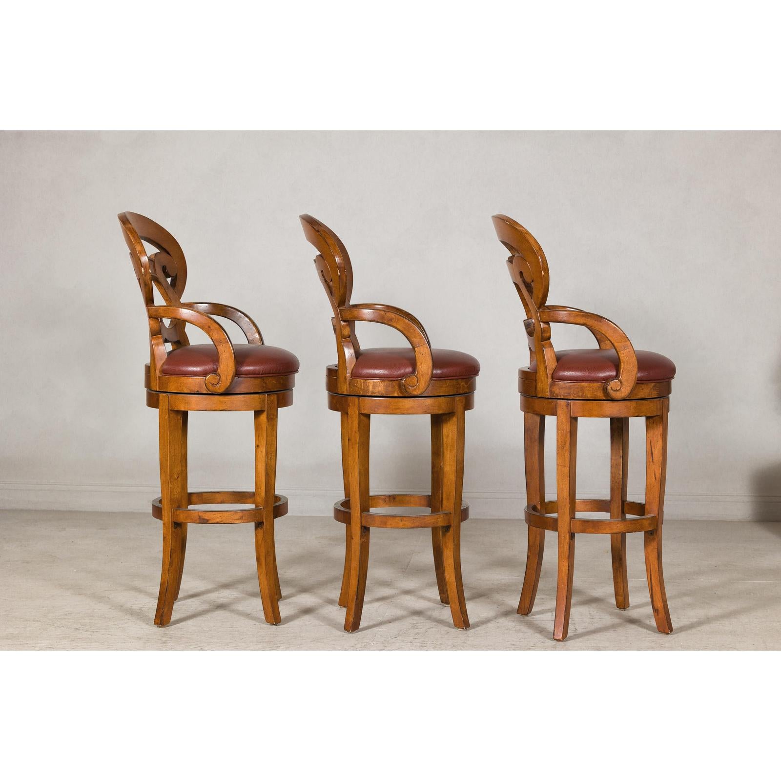 Swivel Bar Stools with Carved Backs and Faux Leather Seats – Set of Three