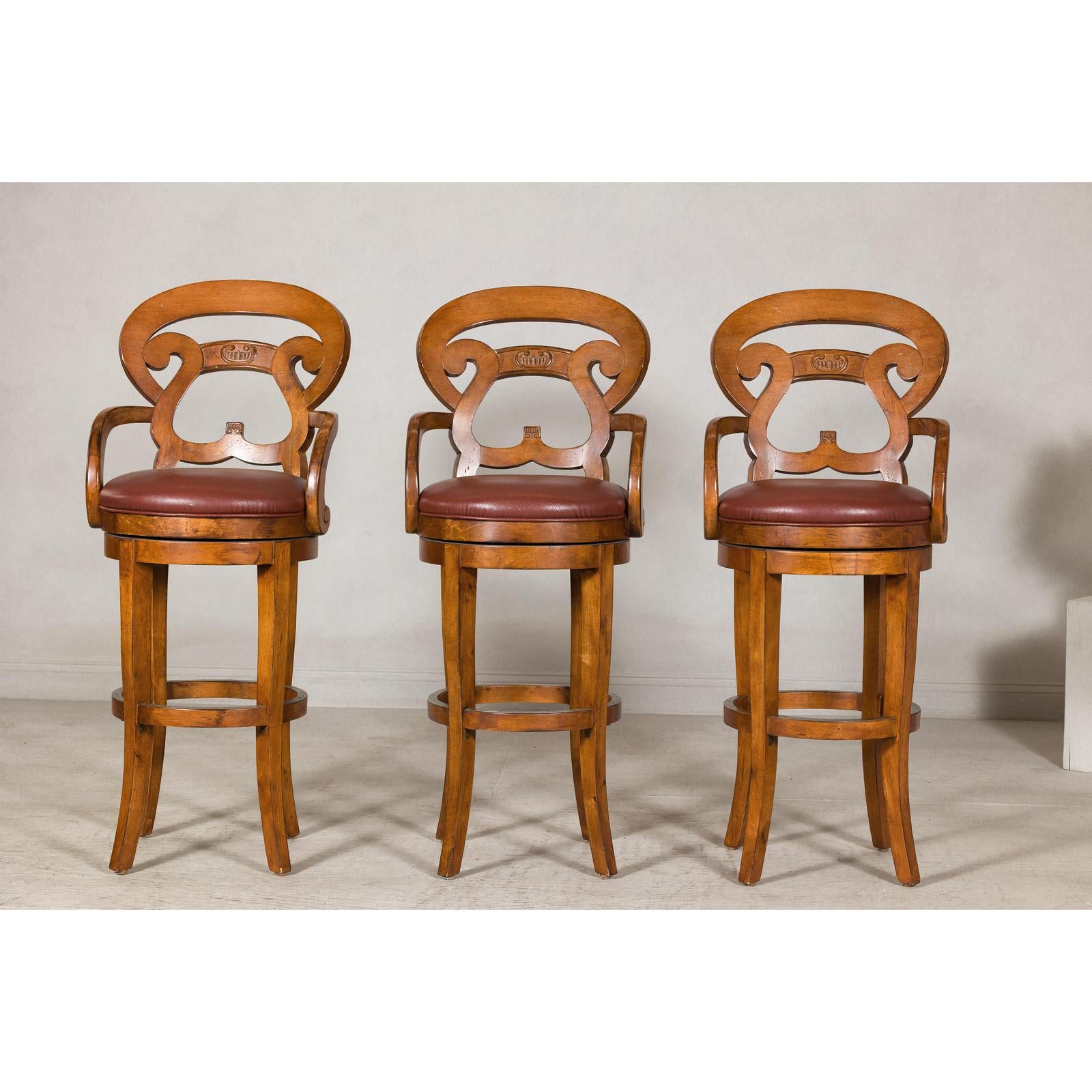 Swivel Bar Stools with Carved Backs and Faux Leather Seats – Set of Three