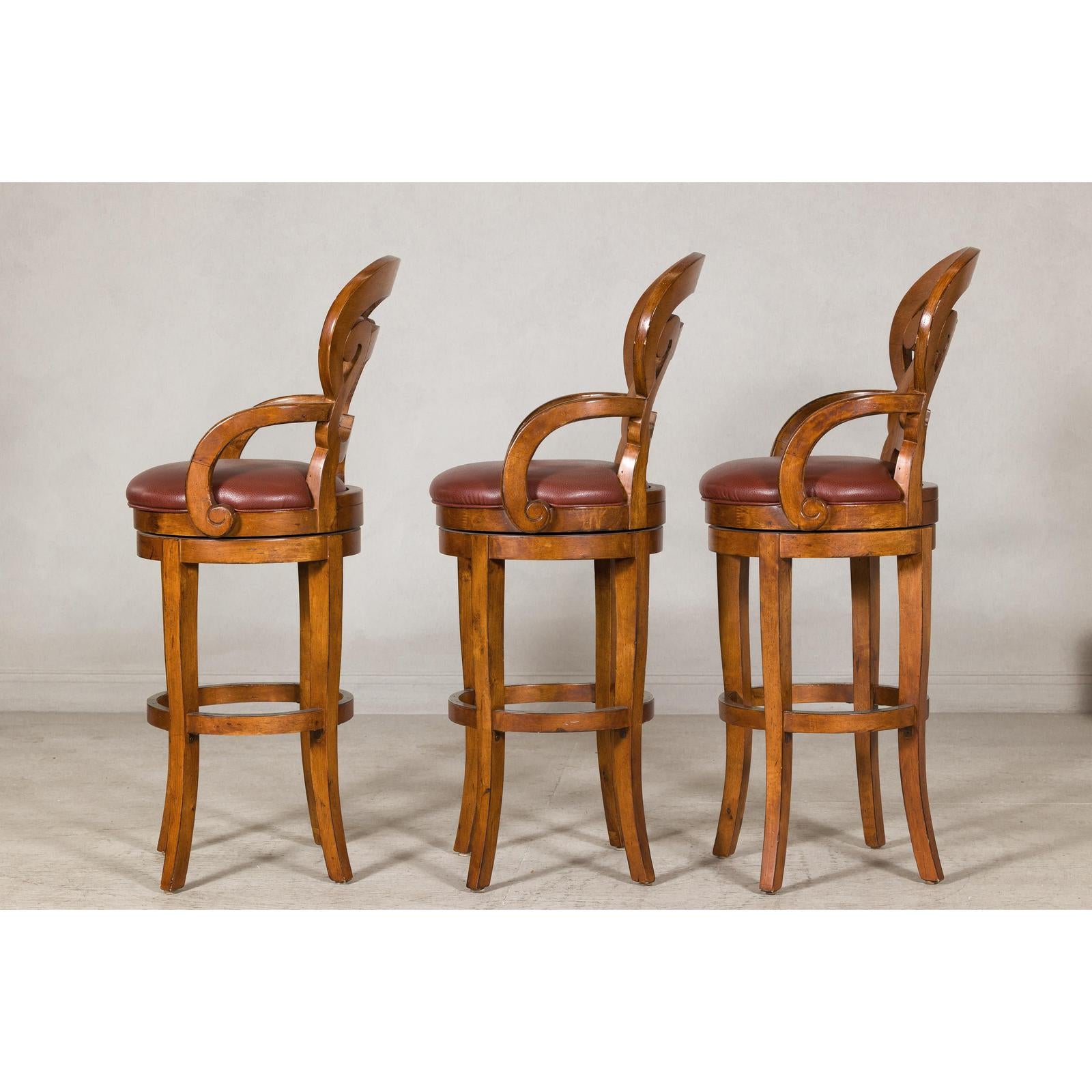 Swivel Bar Stools with Carved Backs and Faux Leather Seats – Set of Three