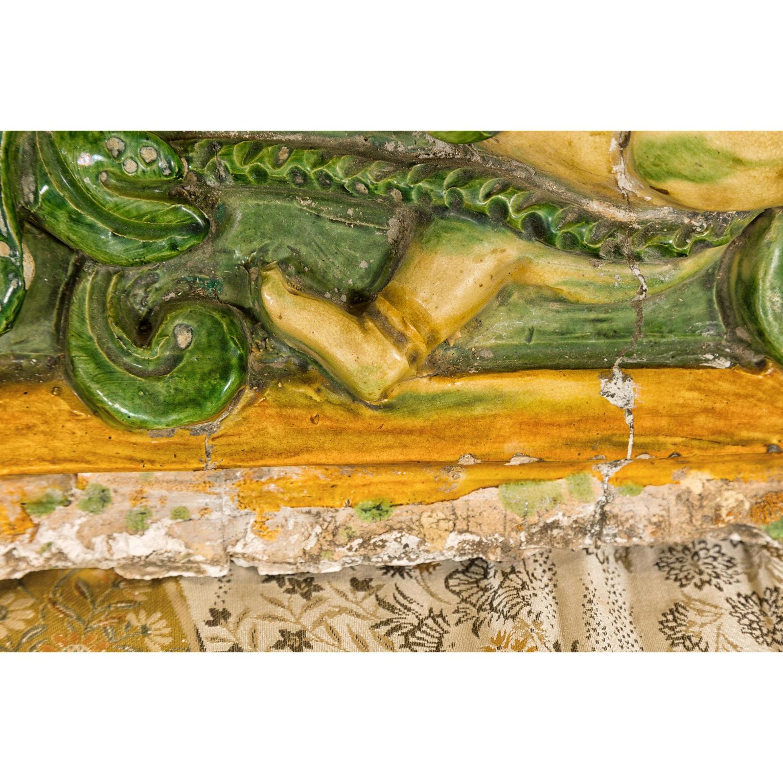 Qing Dynasty Tricolor Roof Fragment from a Temple Depicting a Boy Amidst Leaves