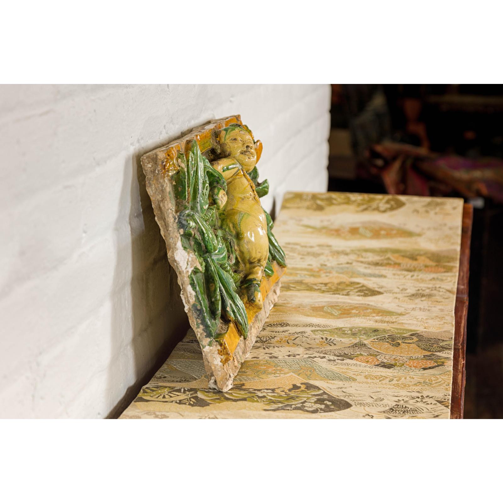 Qing Dynasty Tricolor Raised Relief Roof Fragment from Temple with Boy in Leaves