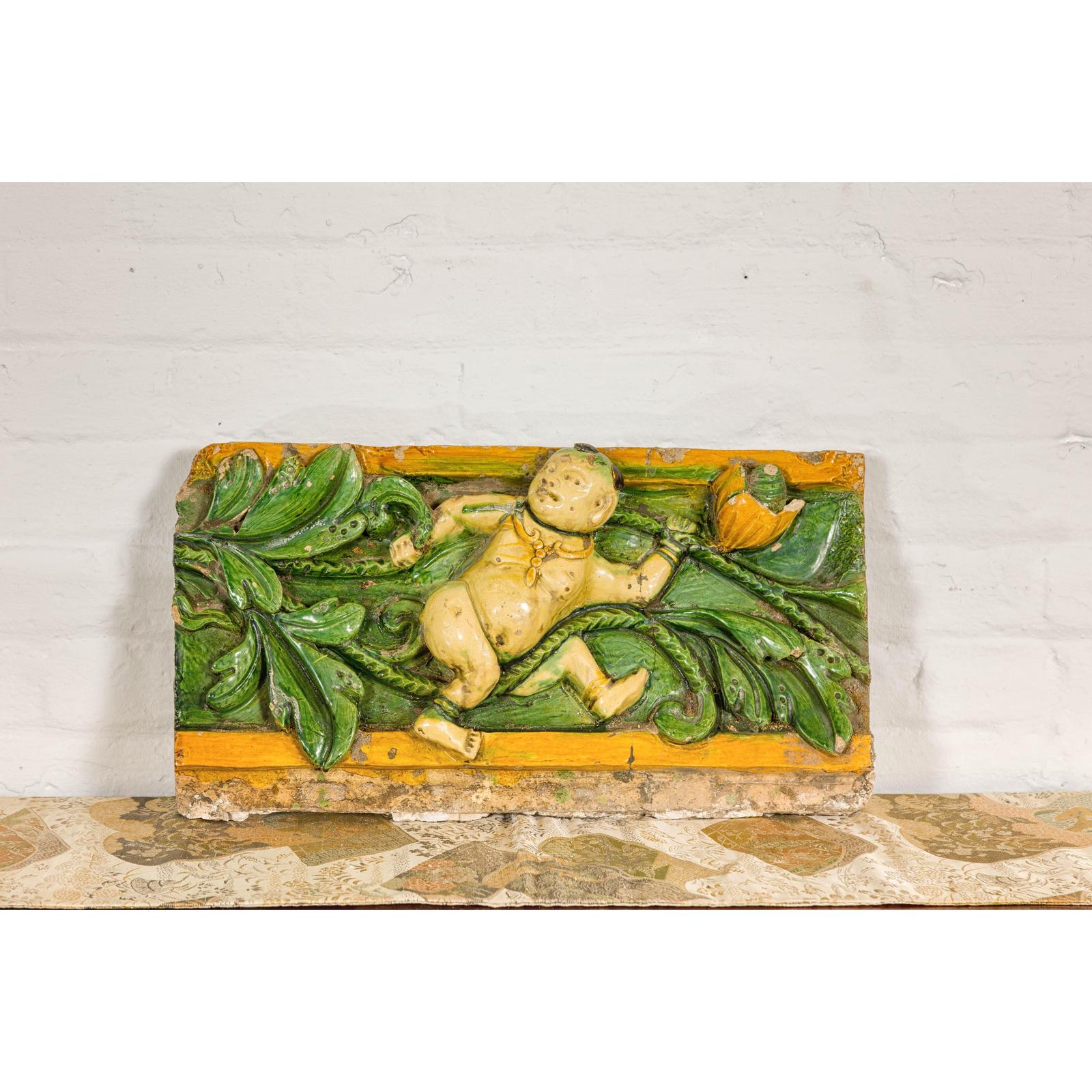 Qing Dynasty Tricolor Raised Relief Roof Fragment from Temple with Boy in Leaves