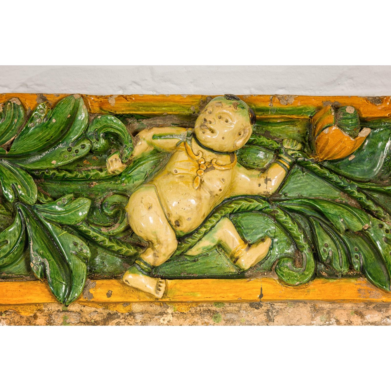 Qing Dynasty Tricolor Raised Relief Roof Fragment from Temple with Boy in Leaves