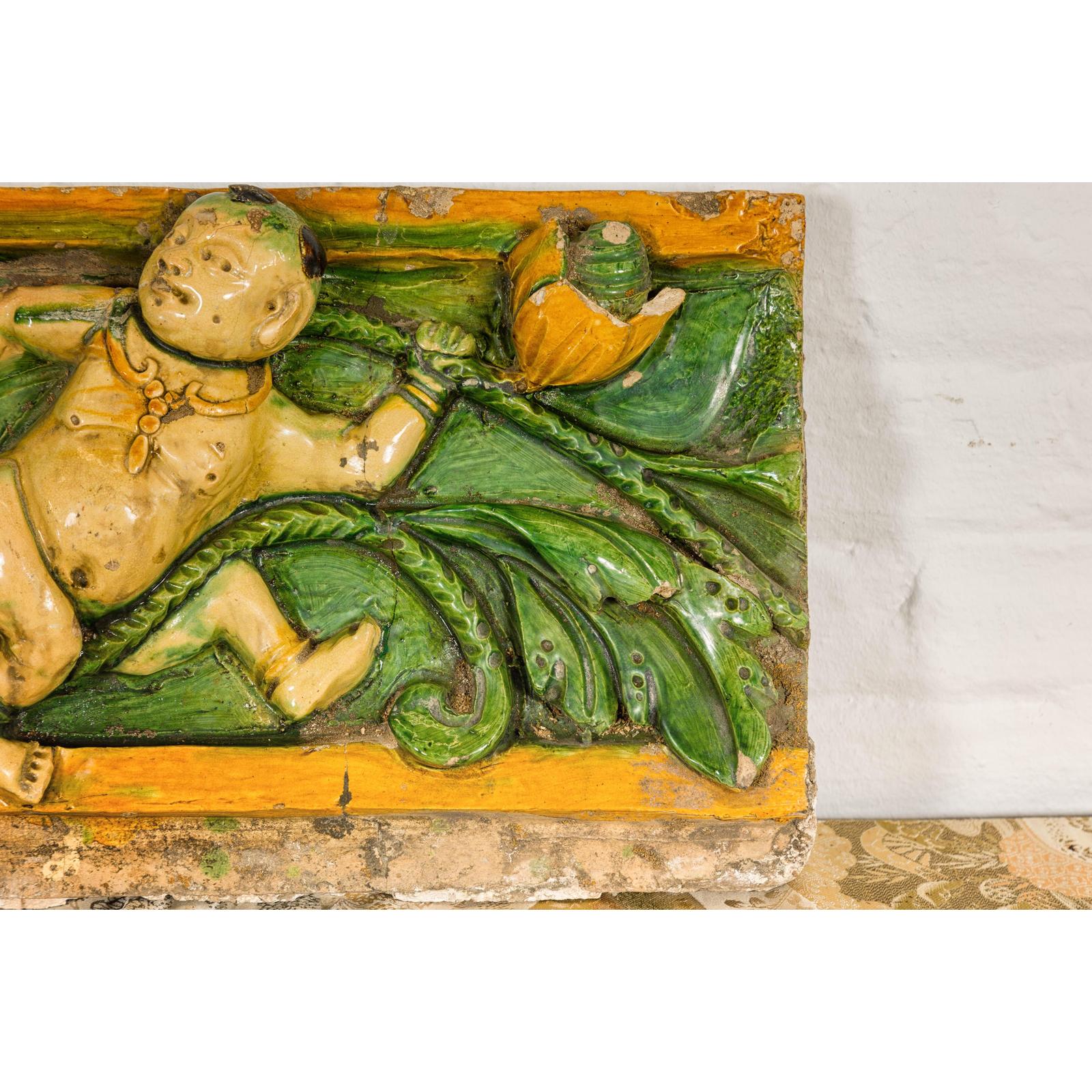 Qing Dynasty Tricolor Raised Relief Roof Fragment from Temple with Boy in Leaves