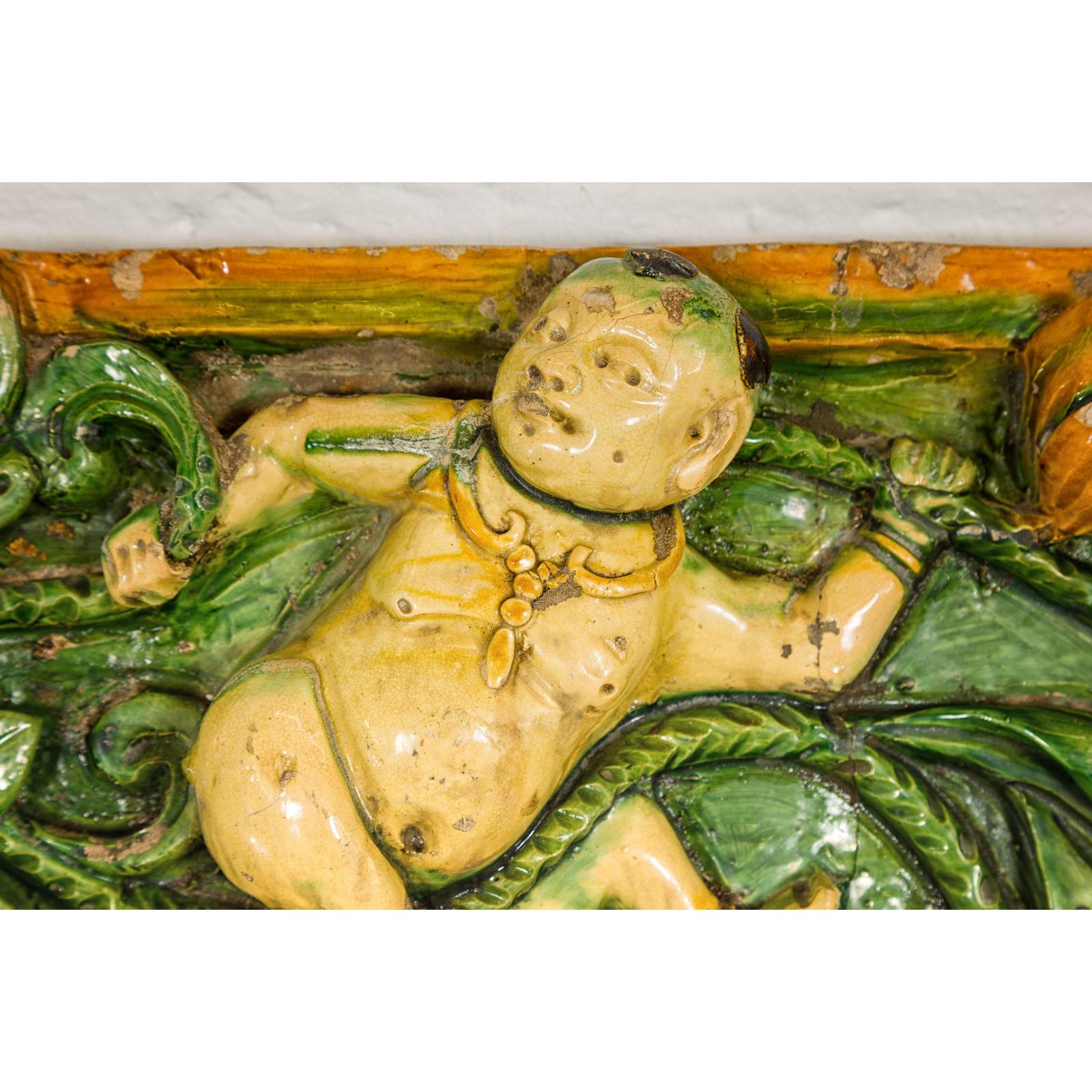 Qing Dynasty Tricolor Raised Relief Roof Fragment from Temple with Boy in Leaves
