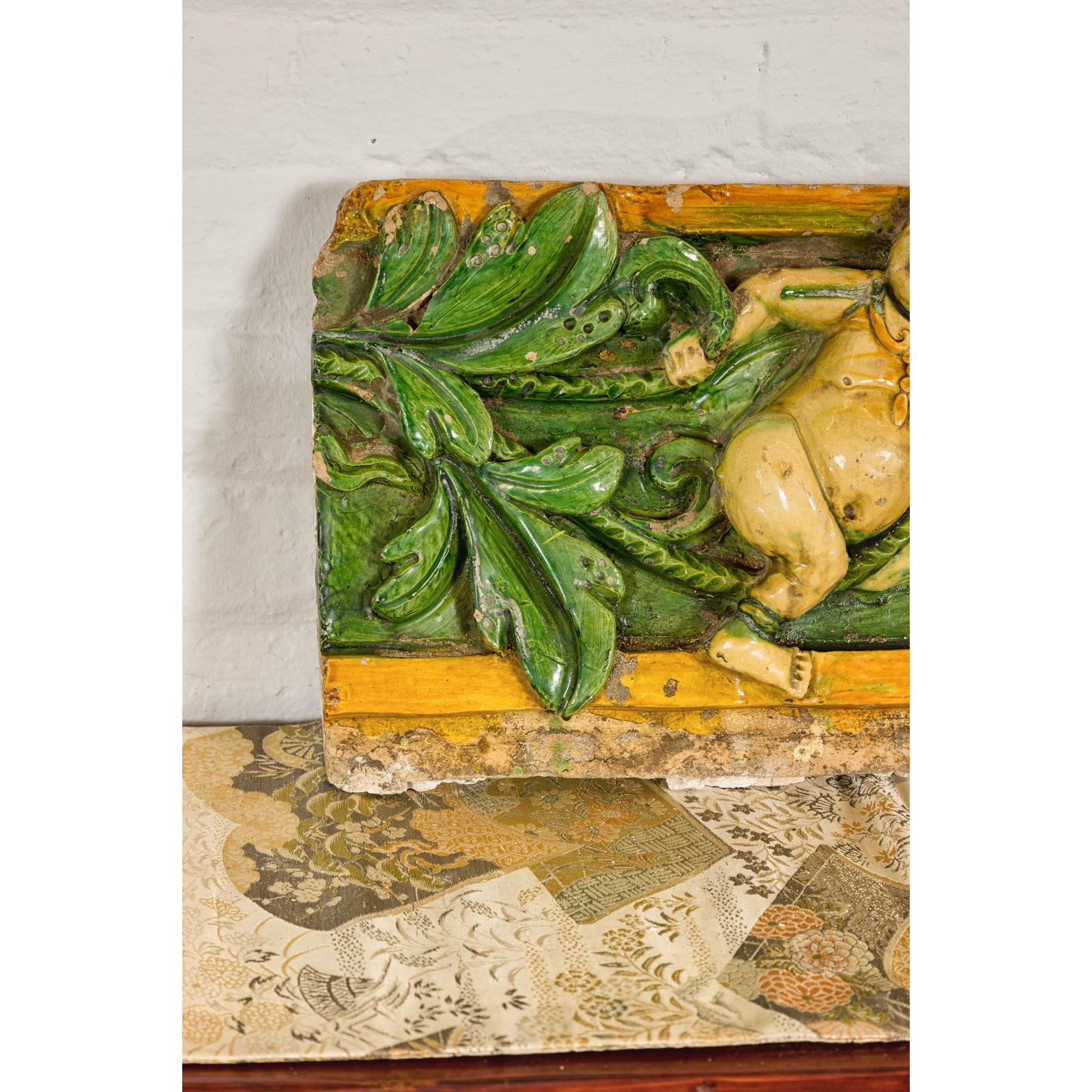 Qing Dynasty Tricolor Raised Relief Roof Fragment from Temple with Boy in Leaves