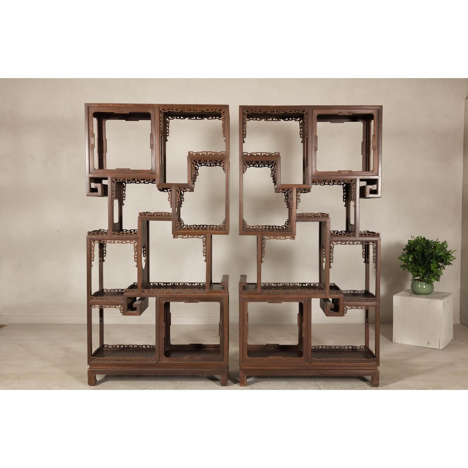 Pair of Late Qing Dynasty Brown Lacquered Display Shelves with Fretwork Motifs