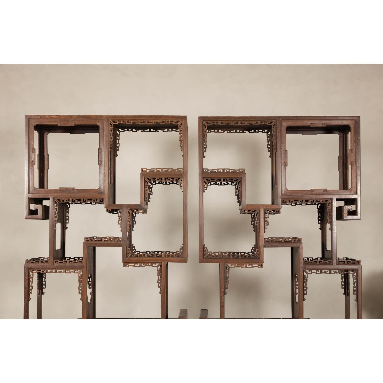 Pair of Late Qing Dynasty Brown Lacquered Display Shelves with Fretwork Motifs