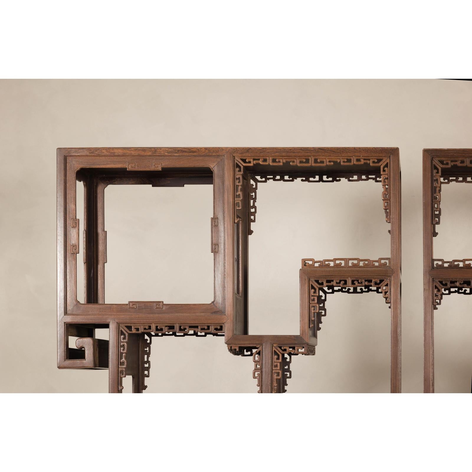 Pair of Late Qing Dynasty Brown Lacquered Display Shelves with Fretwork Motifs