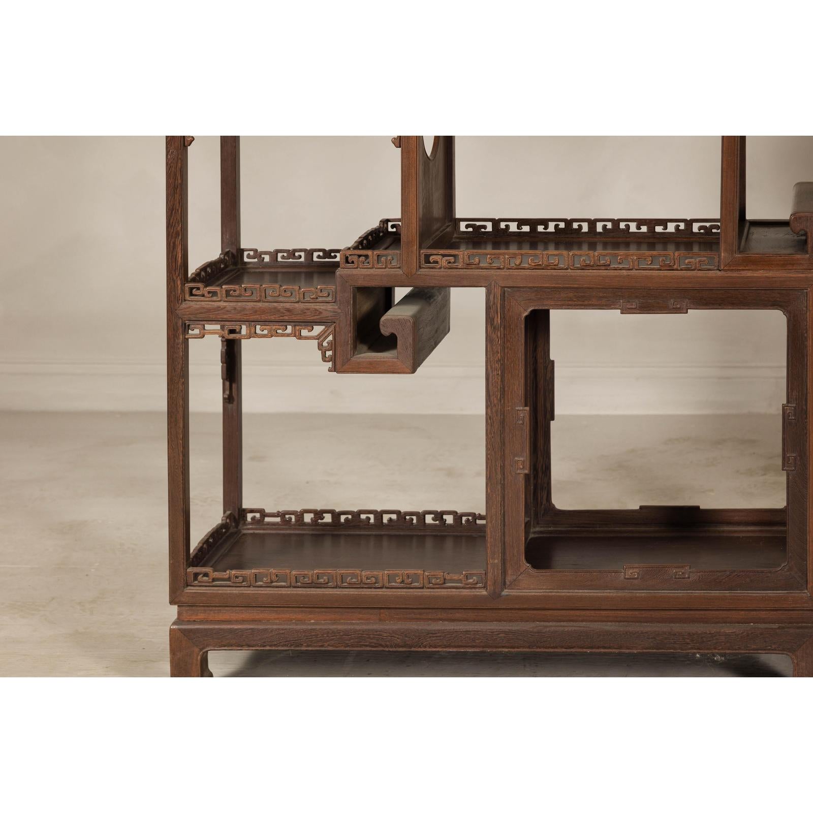 Pair of Late Qing Dynasty Brown Lacquered Display Shelves with Fretwork Motifs