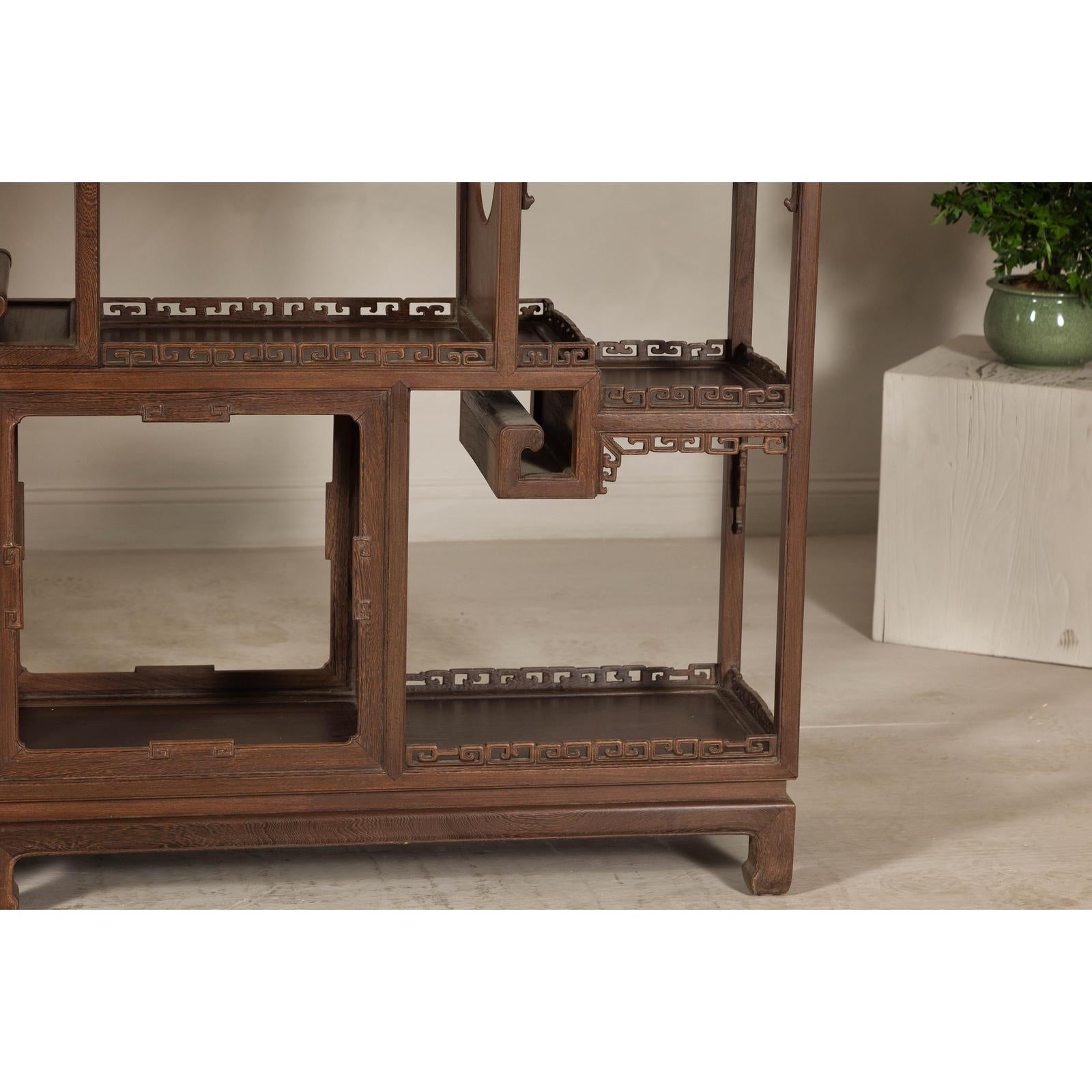 Pair of Late Qing Dynasty Brown Lacquered Display Shelves with Fretwork Motifs