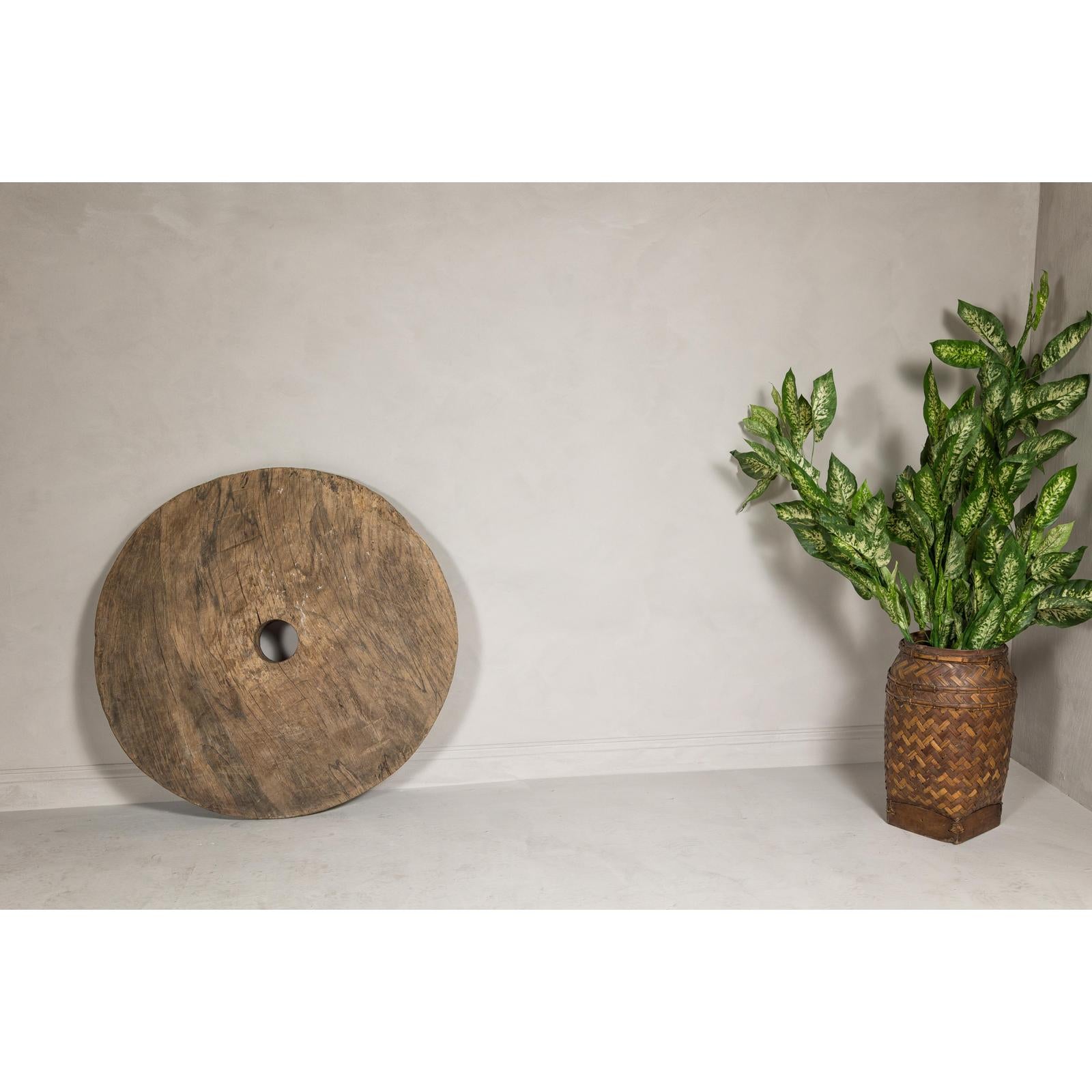 Large Ancient Cart Wheel with Rustic Character and Time-Worn Appearance