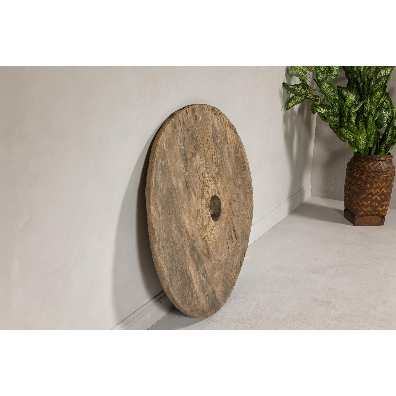 Large Ancient Cart Wheel with Rustic Character and Time-Worn Appearance