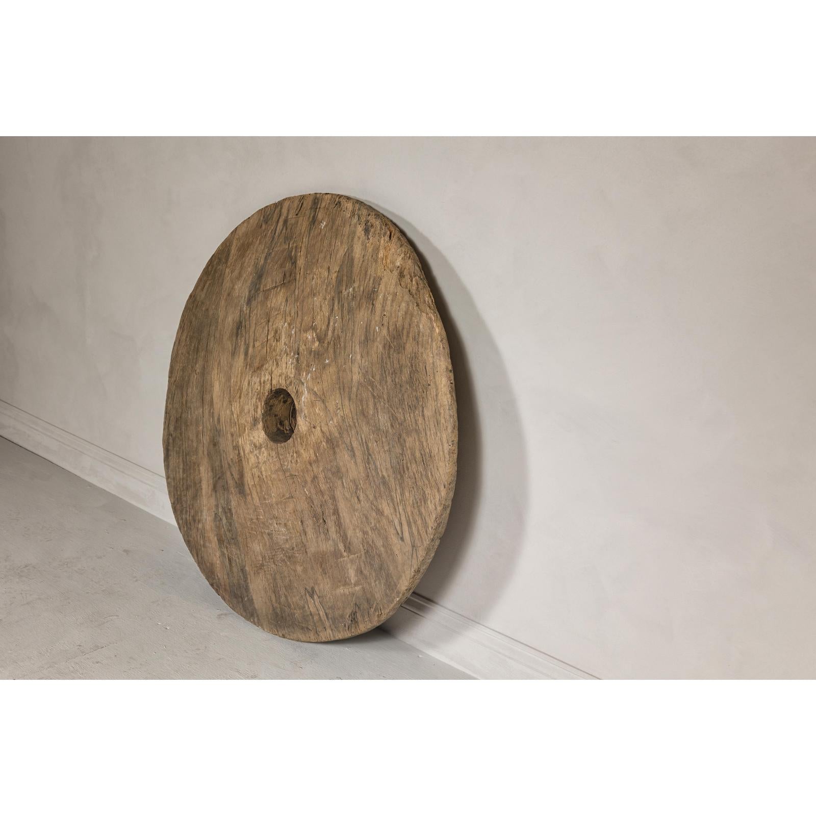 Large Ancient Cart Wheel with Rustic Character and Time-Worn Appearance