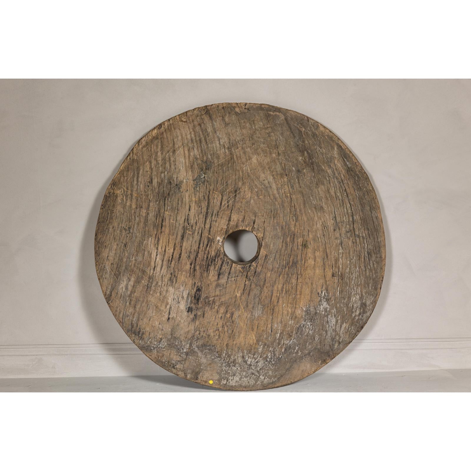 Large Ancient Cart Wheel with Rustic Character and Time-Worn Appearance