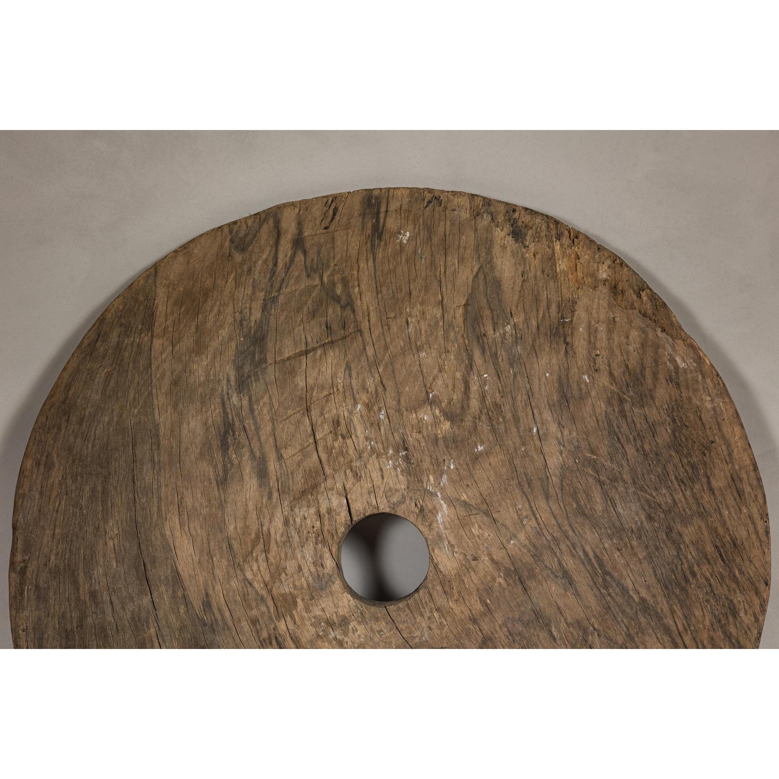 Large Ancient Cart Wheel with Rustic Character and Time-Worn Appearance