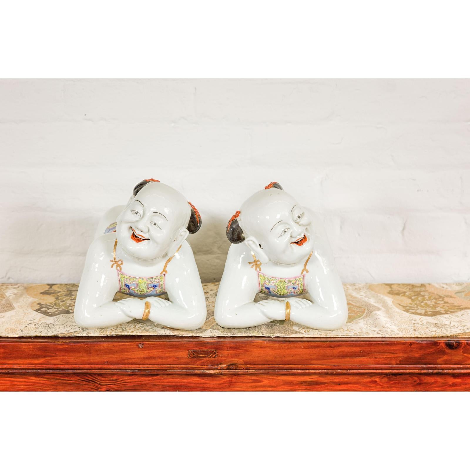 Pair of Qing Dynasty Period Porcelain Tong'zi Figures