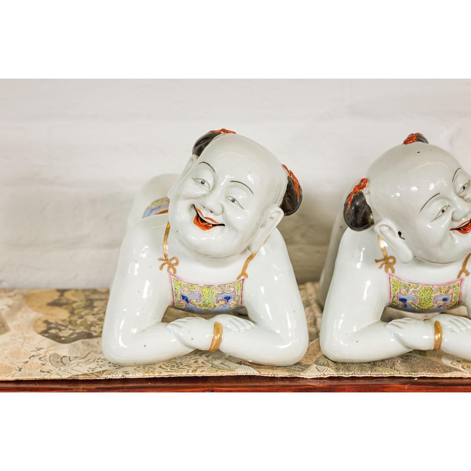 Pair of Qing Dynasty Period Porcelain Tong'zi Figures