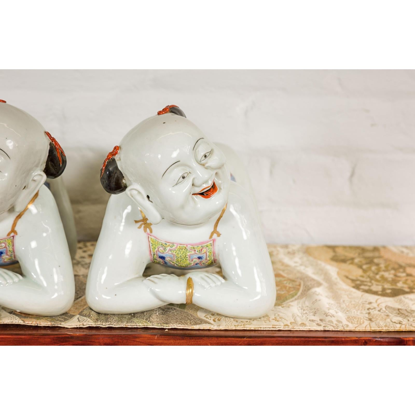 Pair of Qing Dynasty Period Porcelain Tong'zi Figures