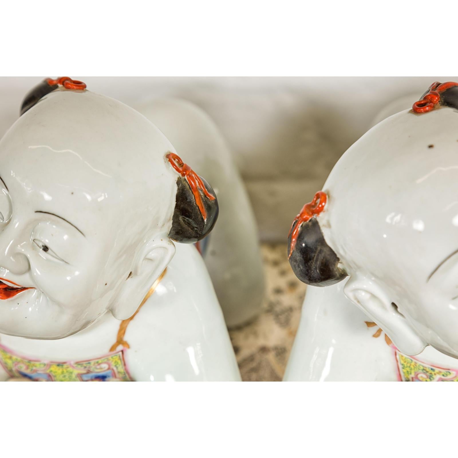 Pair of Qing Dynasty Period Porcelain Tong'zi Figures