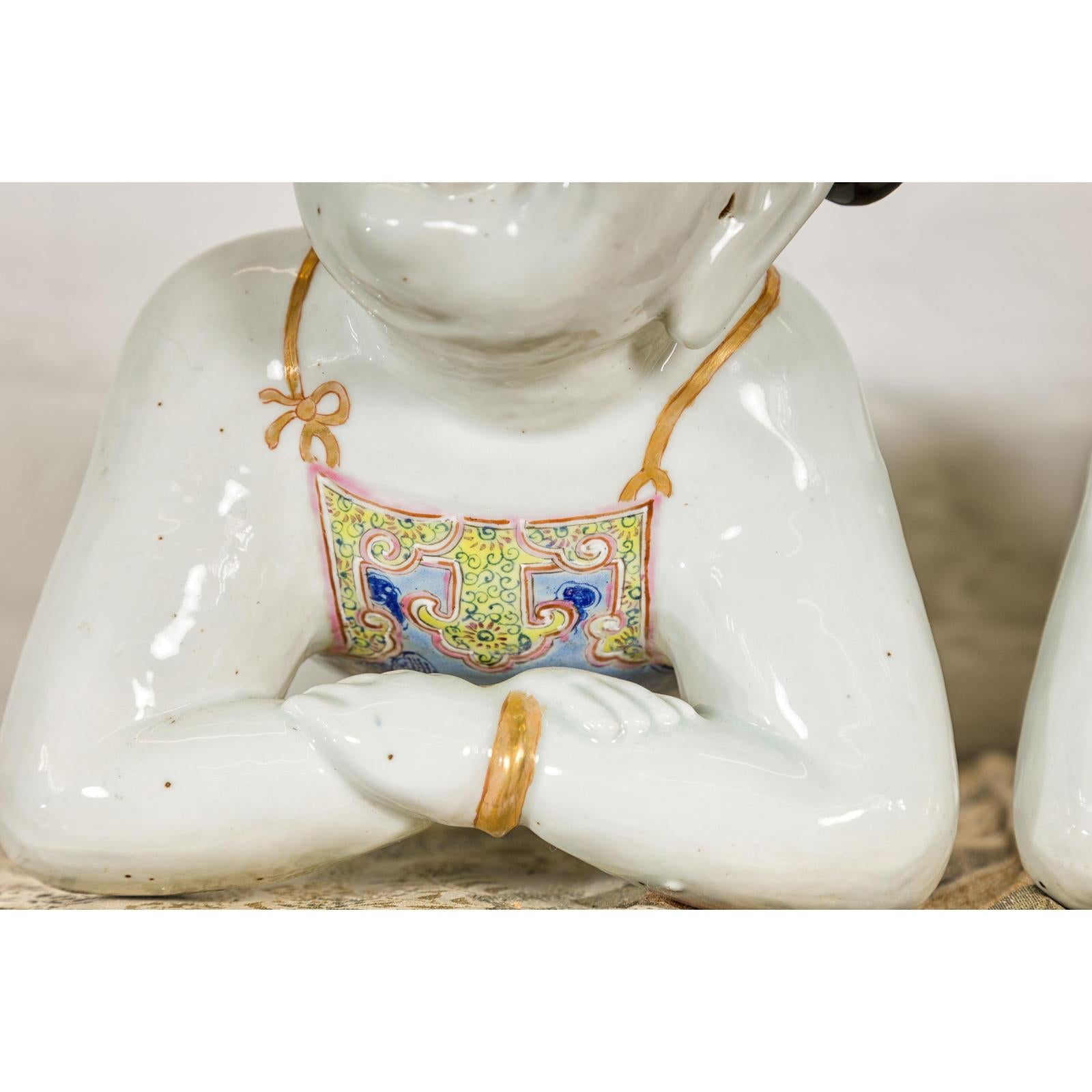 Pair of Qing Dynasty Period Porcelain Tong'zi Figures