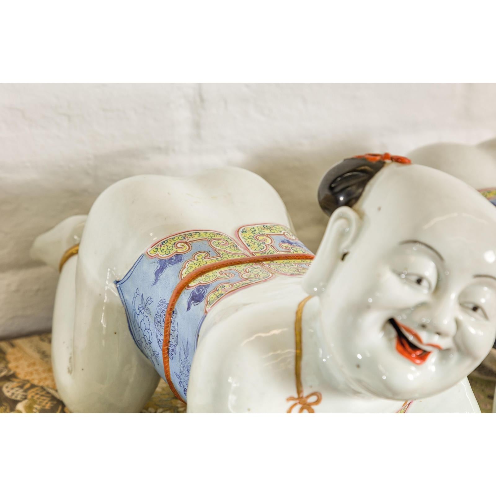 Pair of Qing Dynasty Period Porcelain Tong'zi Figures