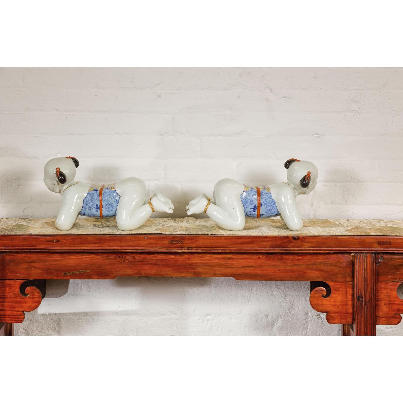 Pair of Qing Dynasty Period Porcelain Tong'zi Figures
