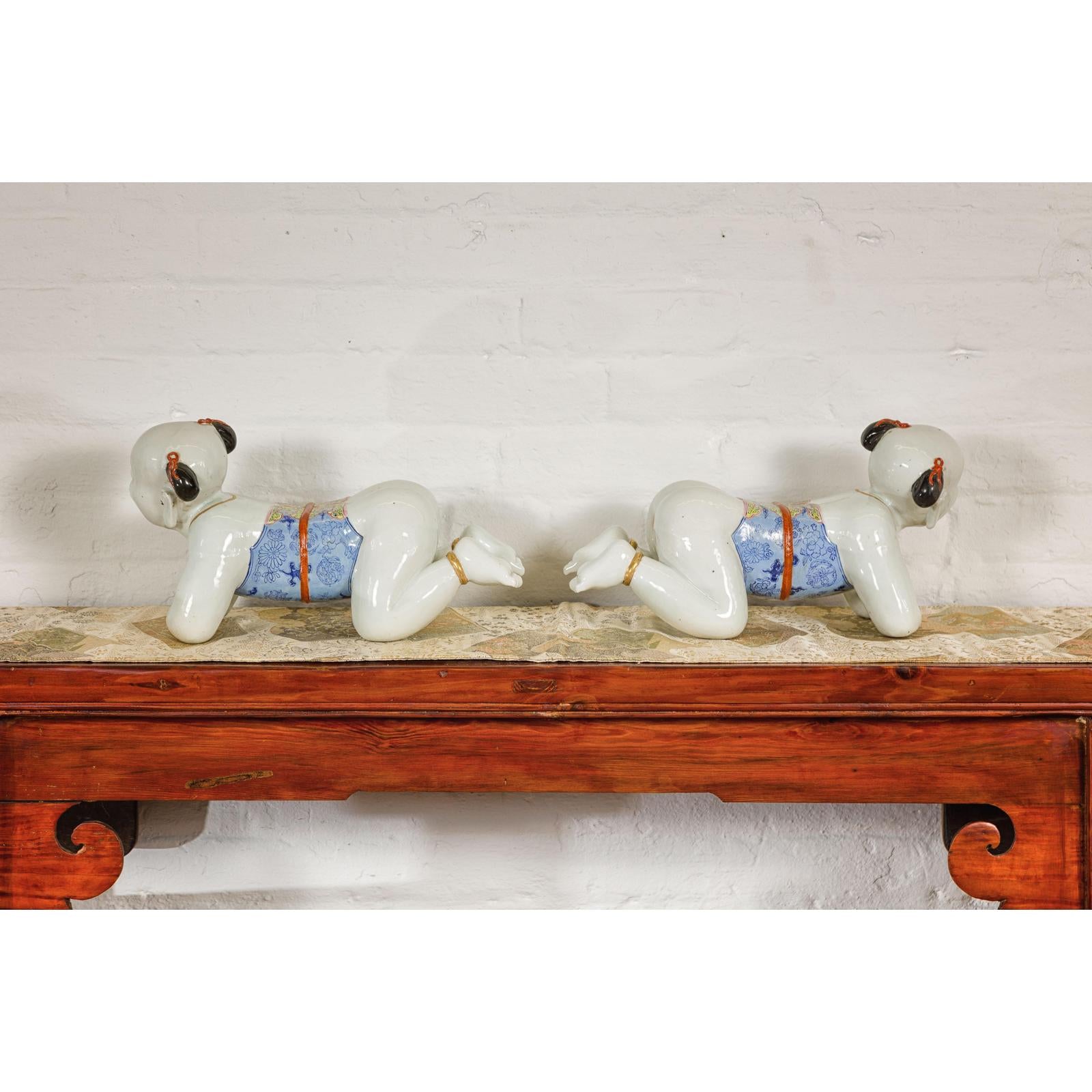 Pair of Qing Dynasty Period Porcelain Tong'zi Figures