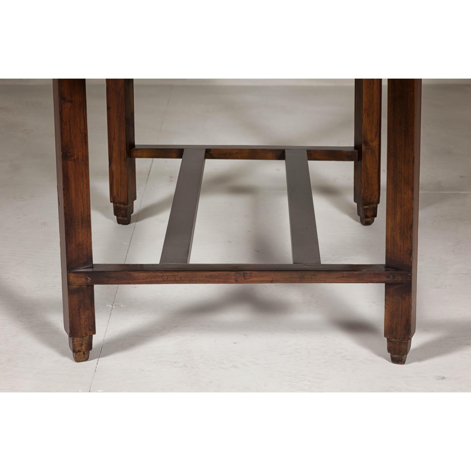 Oval Top Center Table with Inverted Stepped Pyramid Feet and Cross Stretcher