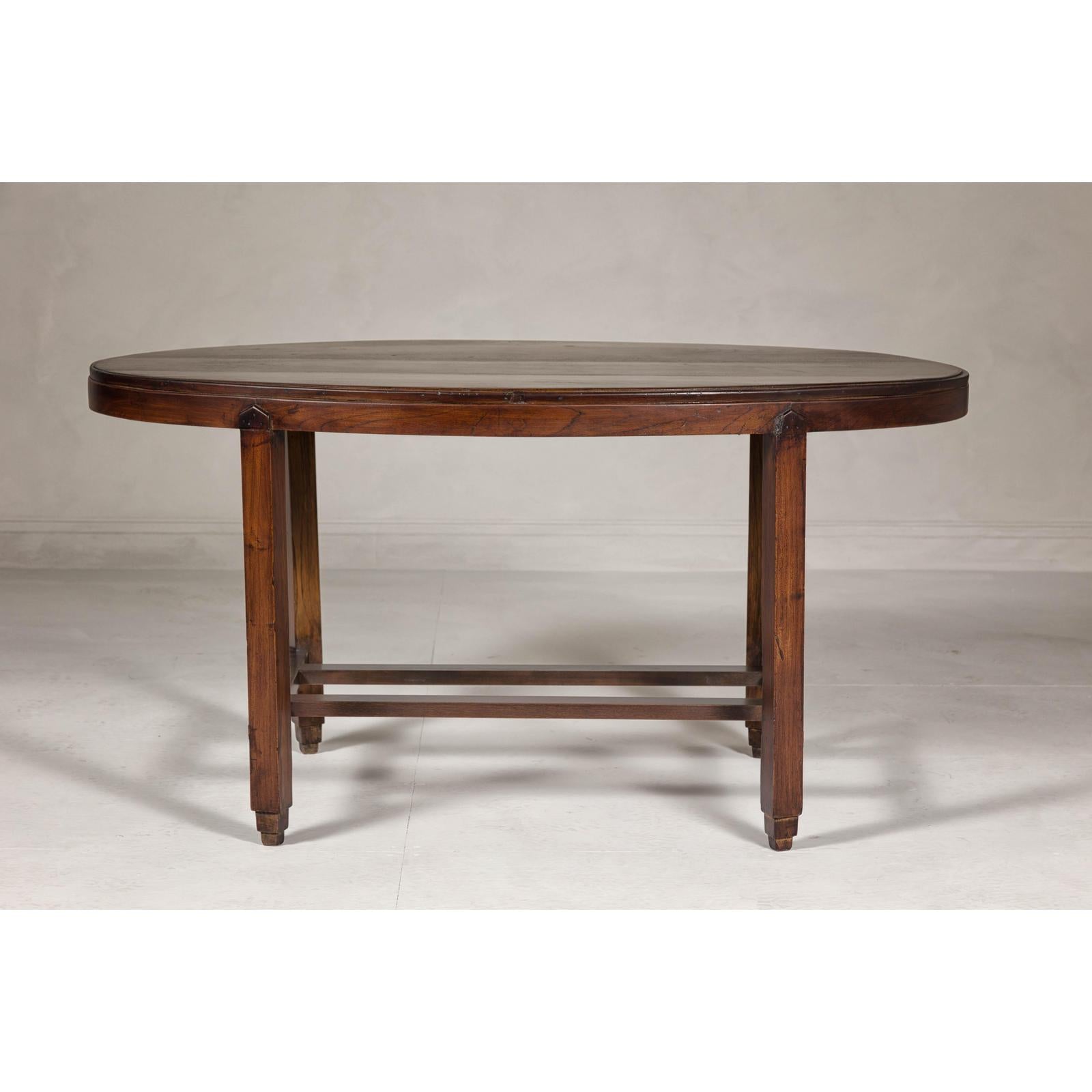 Oval Top Center Table with Inverted Stepped Pyramid Feet and Cross Stretcher