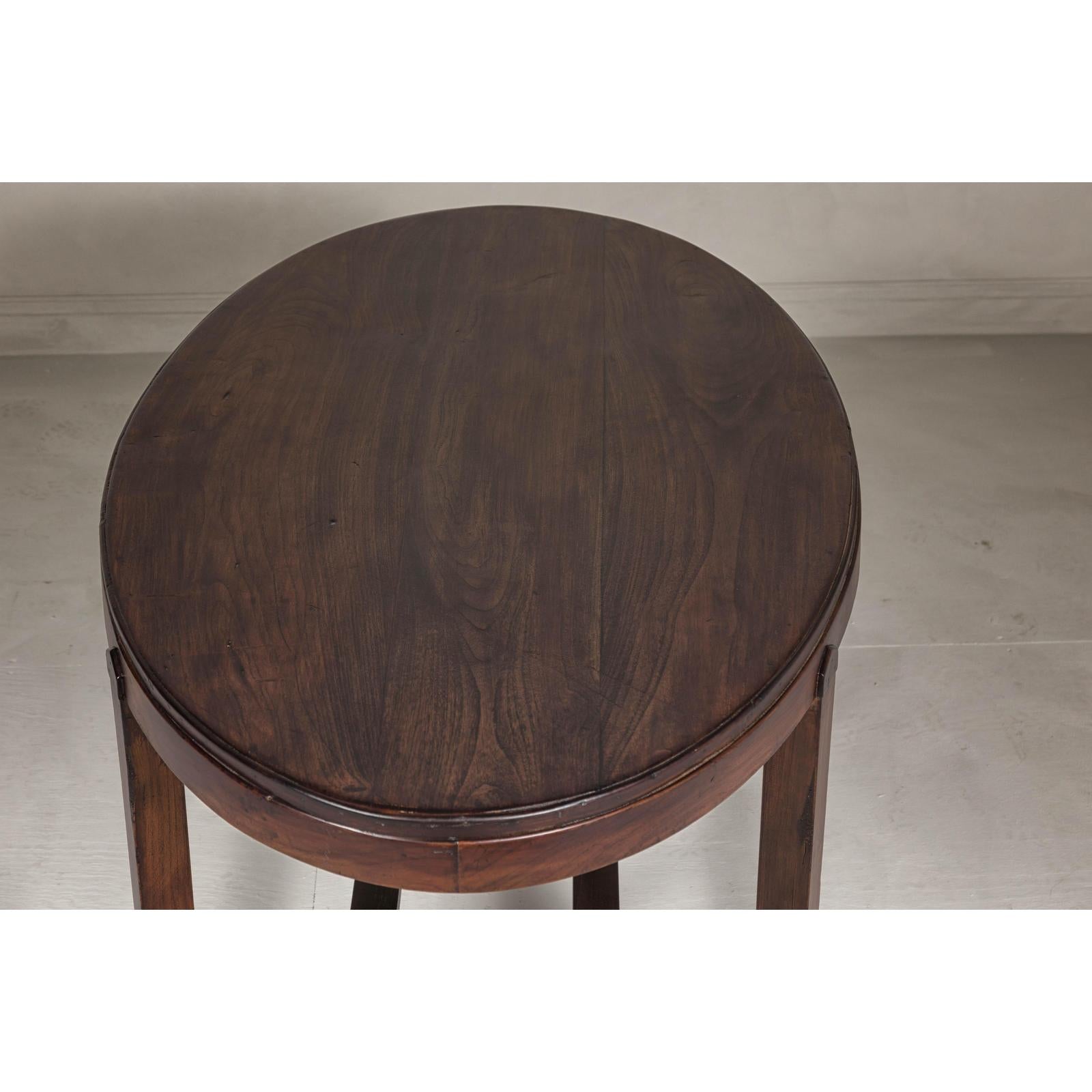 Oval Top Center Table with Inverted Stepped Pyramid Feet and Cross Stretcher