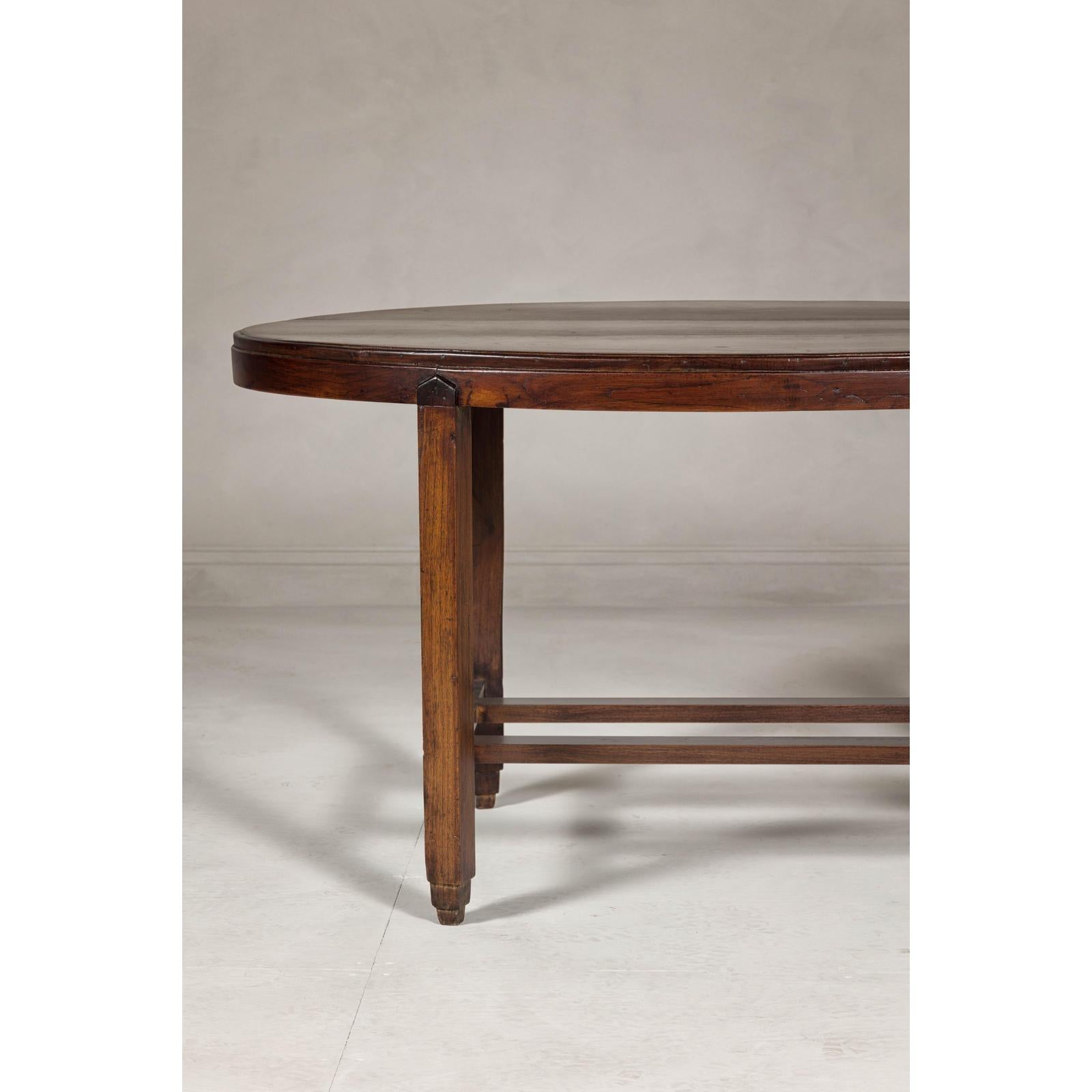 Oval Top Center Table with Inverted Stepped Pyramid Feet and Cross Stretcher