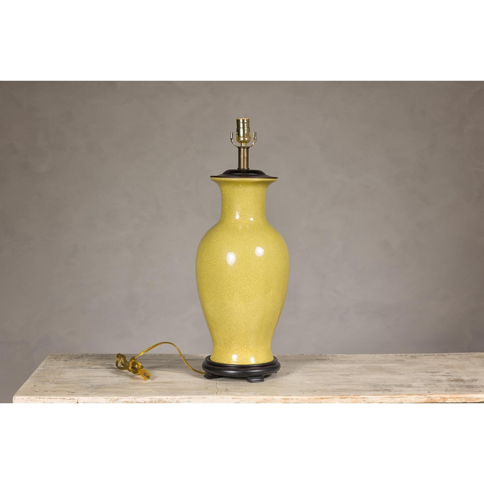 Yellow Crackle Glazed Ceramic Vase with Round Belly on Wooden Base