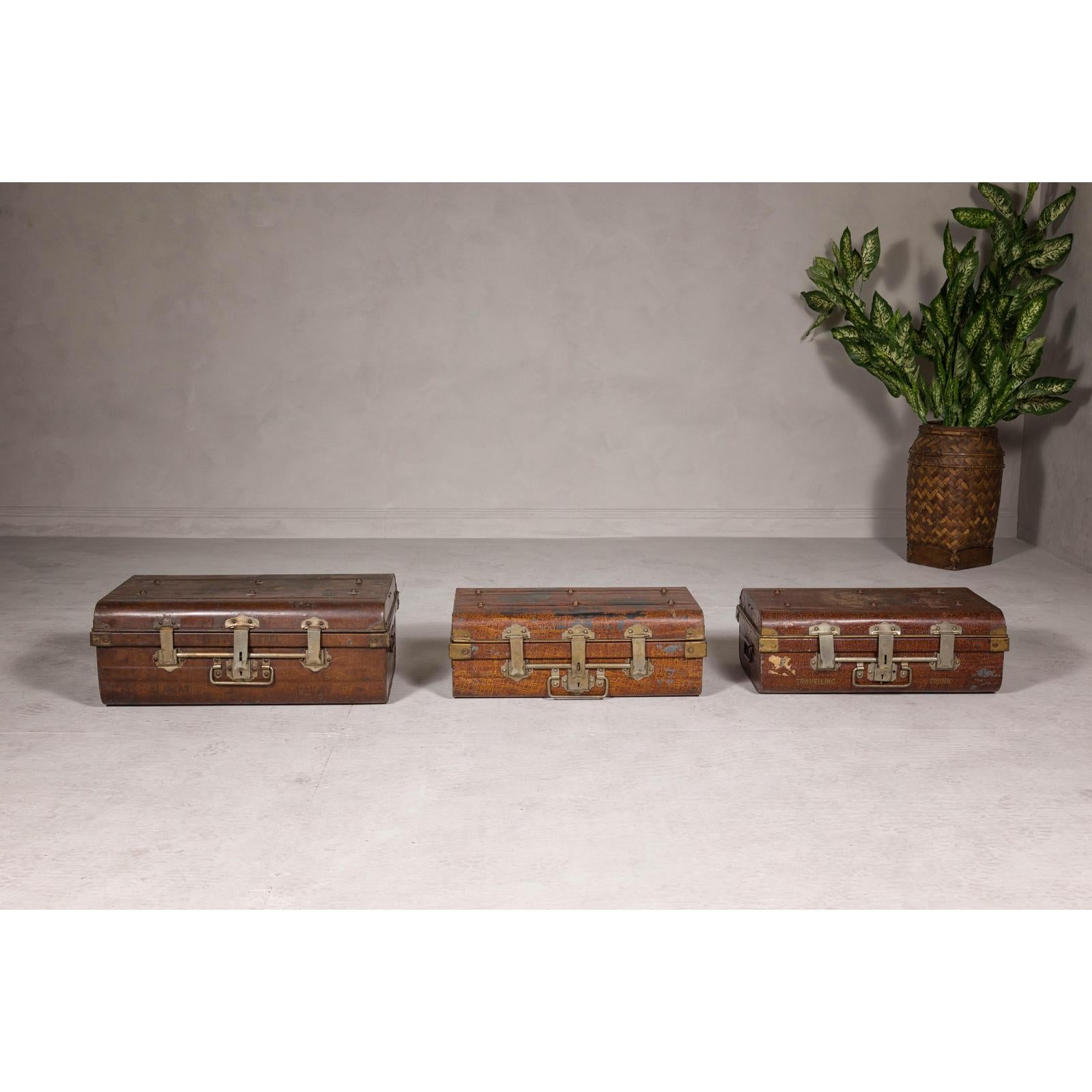 Set of Three British 1920s Metal Traveling Trunks for Export with Brass Hardware
