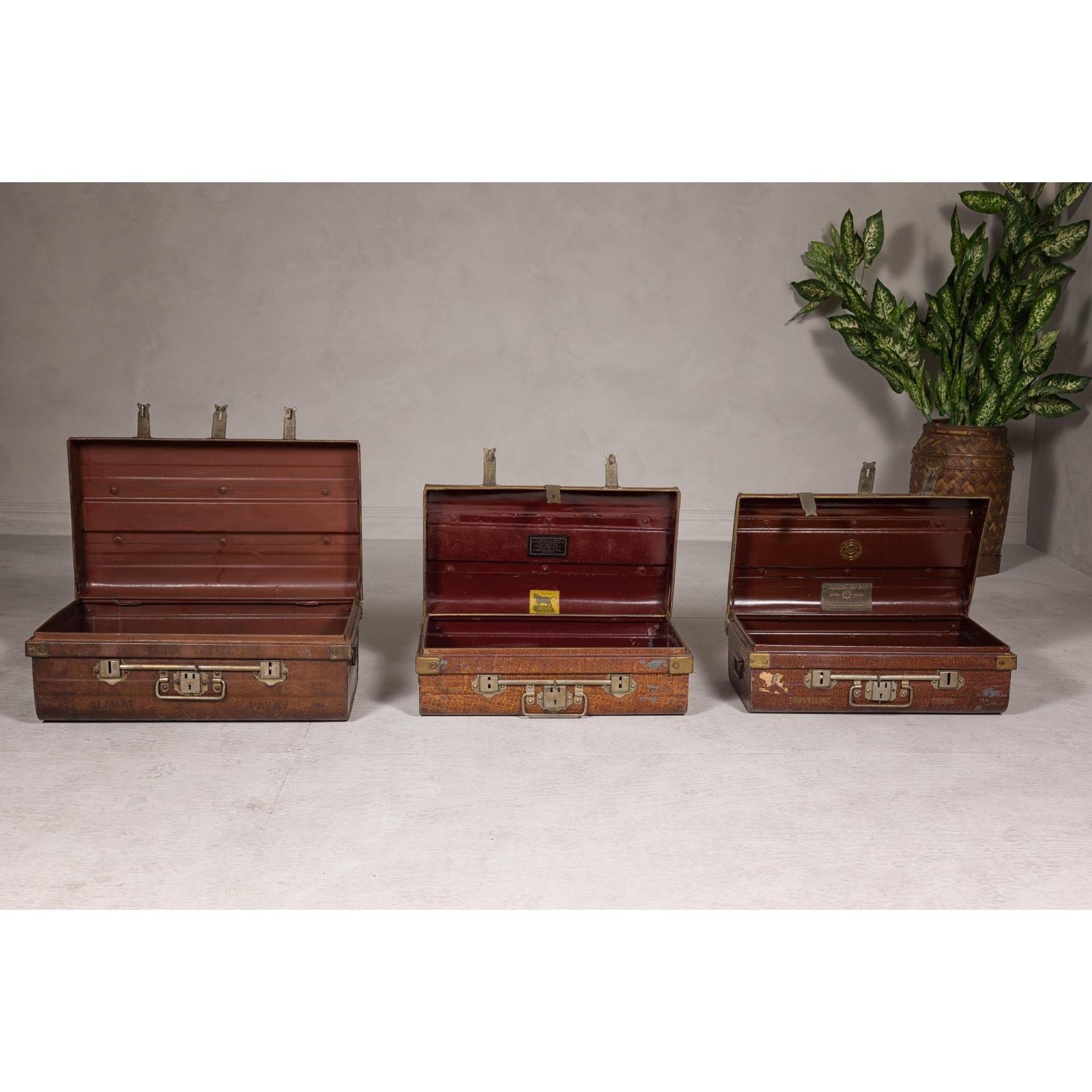 Set of Three British 1920s Metal Traveling Trunks for Export with Brass Hardware