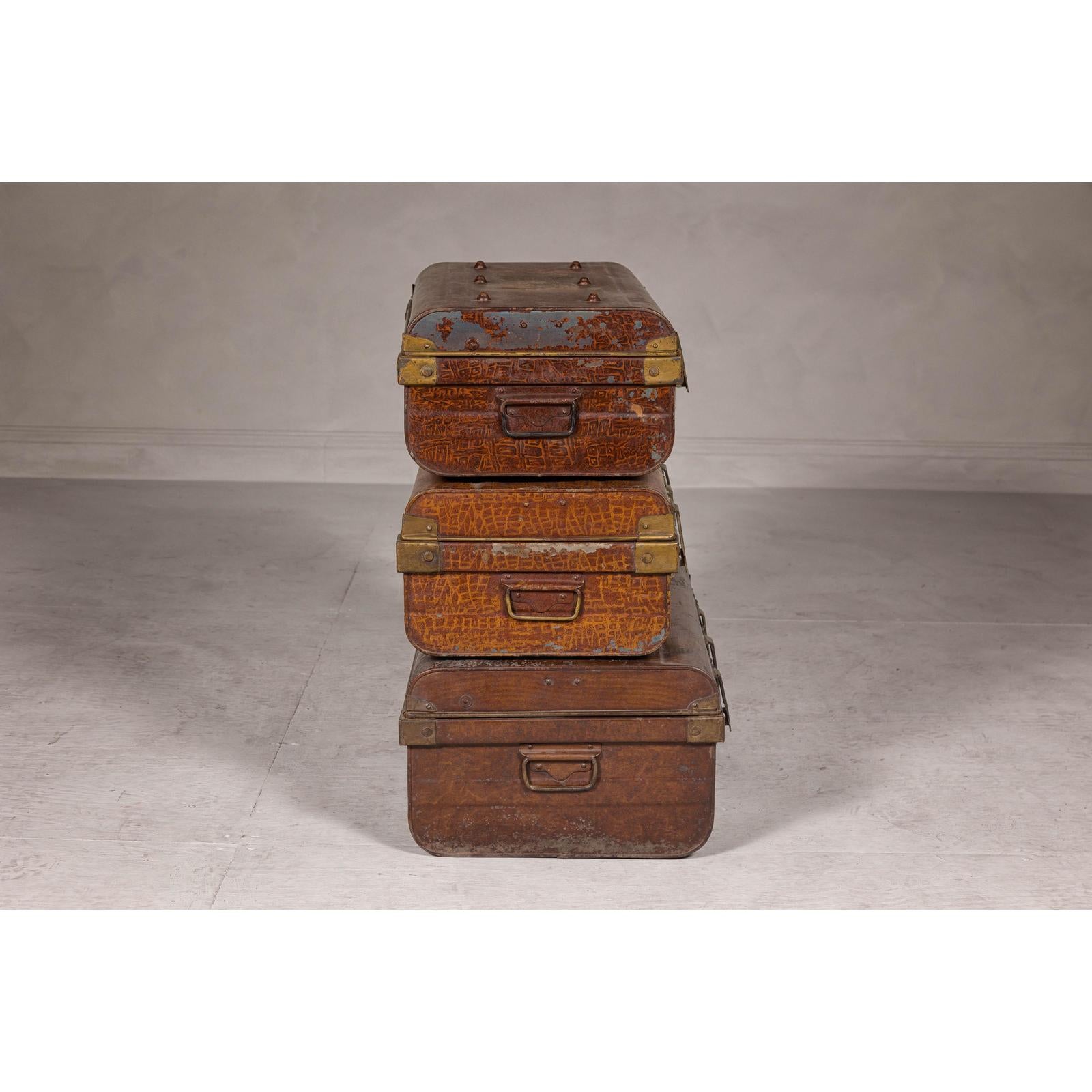 Set of Three British 1920s Metal Traveling Trunks for Export with Brass Hardware