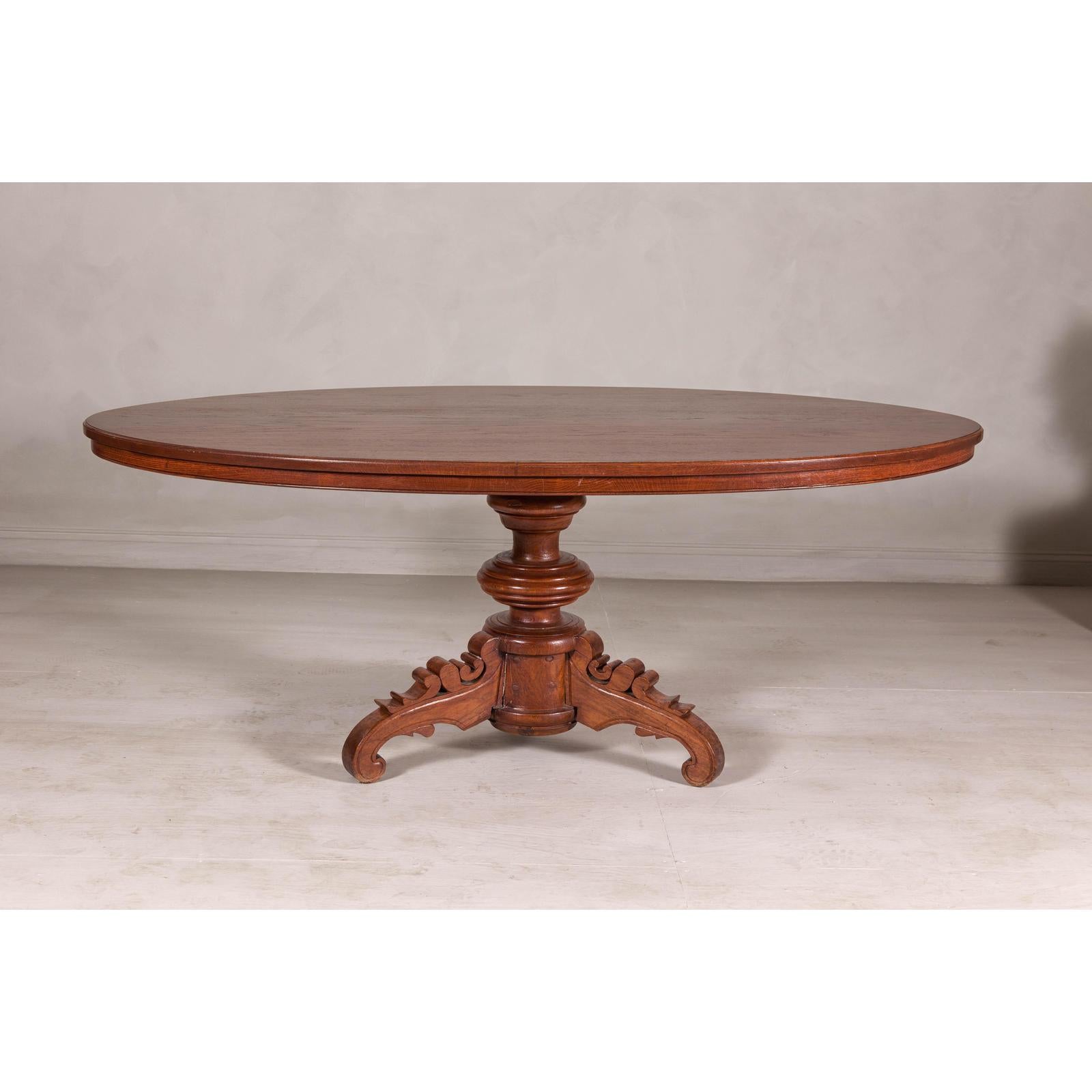 Dutch Colonial Oval Pedestal Dining Table with Scrolling Base, Late 19th Century