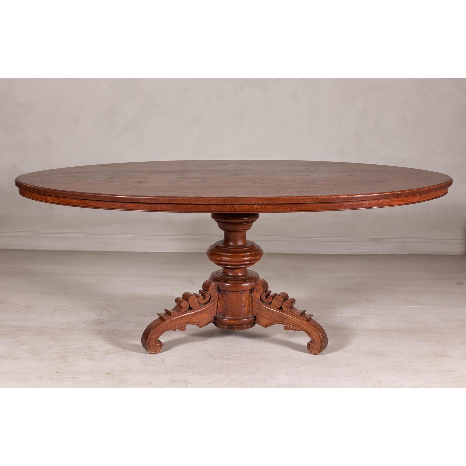 Dutch Colonial Oval Pedestal Dining Table with Scrolling Base, Late 19th Century